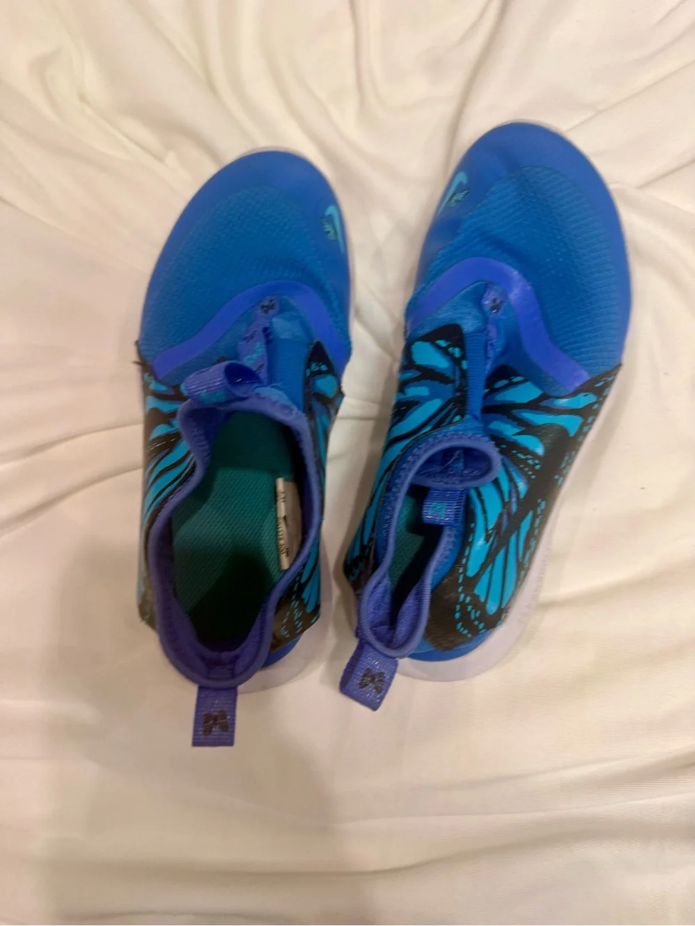 Nike Kids Blue Slip-On Sneakers with Teal and Black Accent